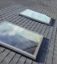 Roofing professionals working on a home roof